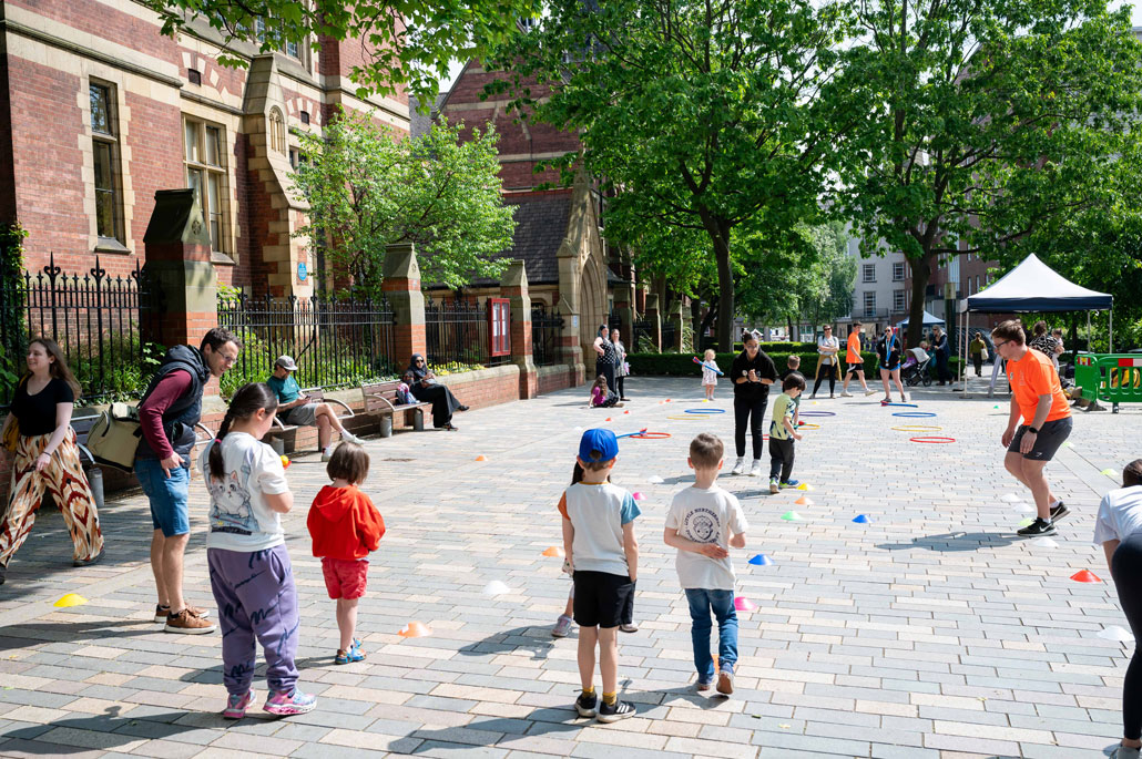 Children playing outside the Great Hall at the University of Leeds Be Curious event