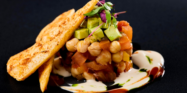Mexican bean and avocado salad and crispy tortilla chip stack