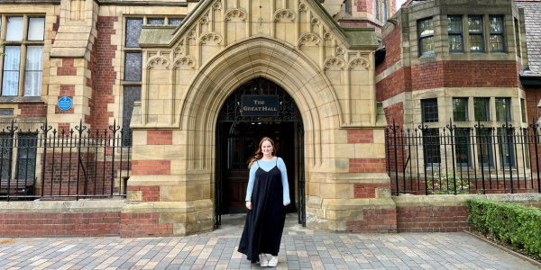 Rosie Lee-Phillips standing outside the Great Hall